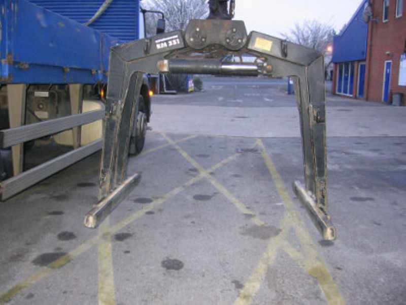 Jewson driver clamped builder in crane grab